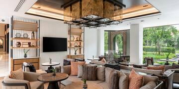 a room with a couch and tables