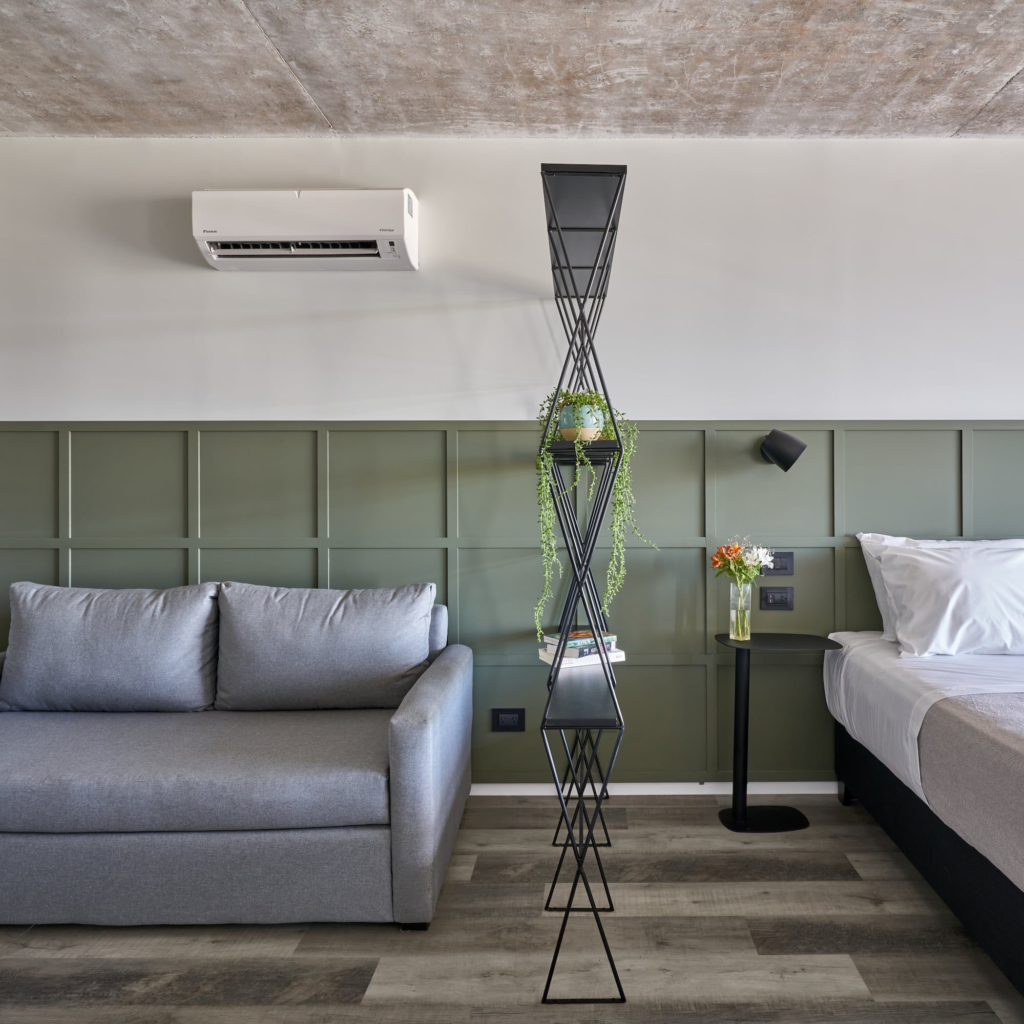 a room with two beds and a couch