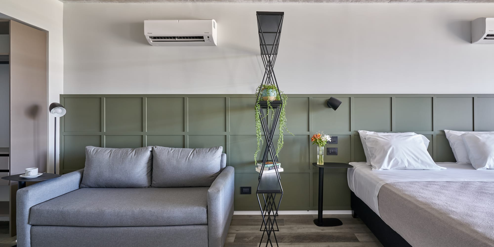 a room with two beds and a couch