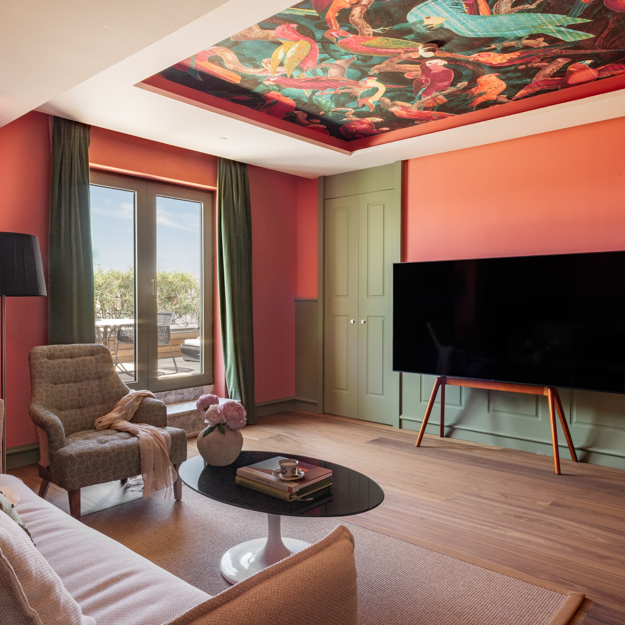 a living room with a tv and couches