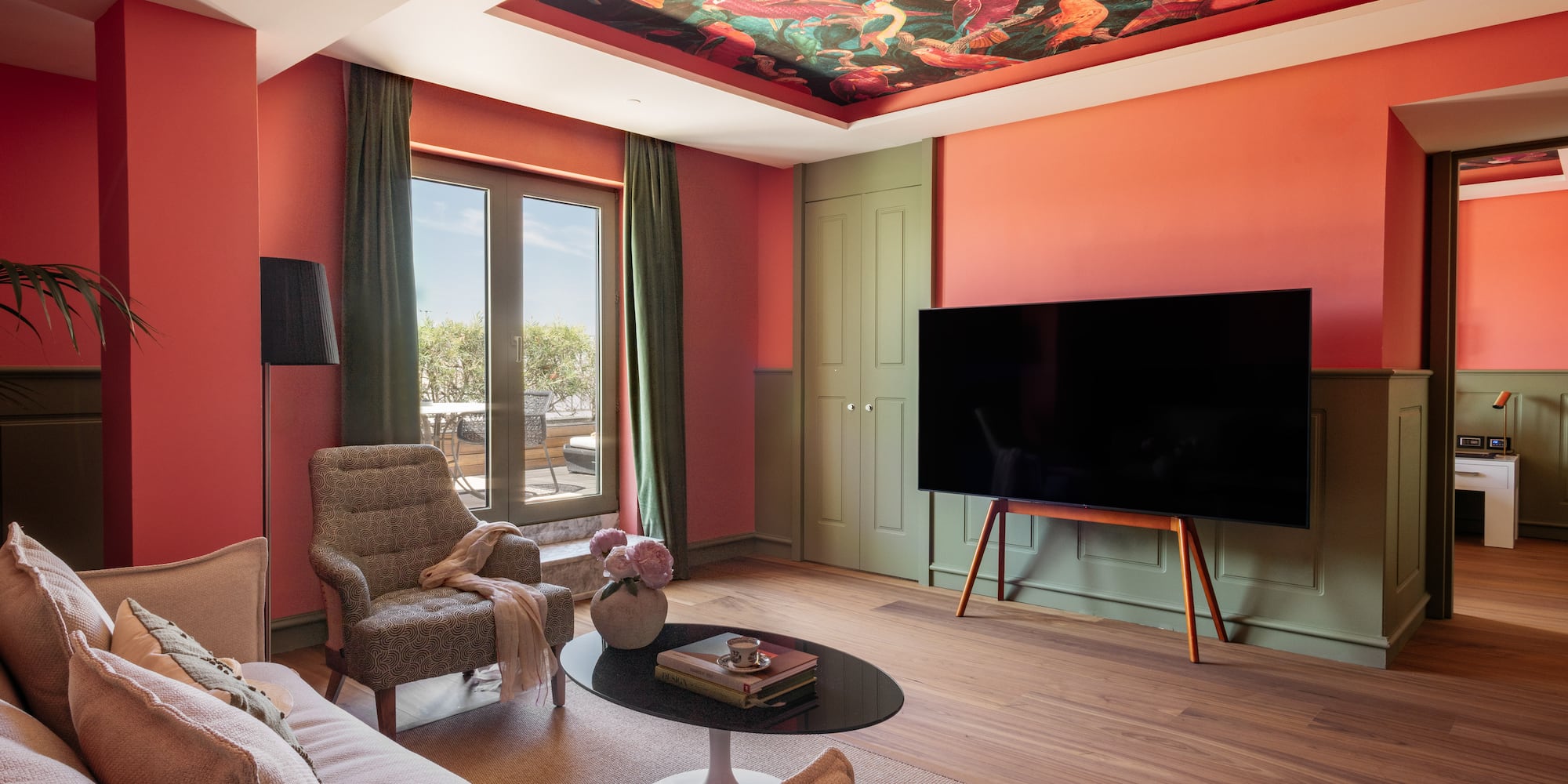 a living room with a tv and couches