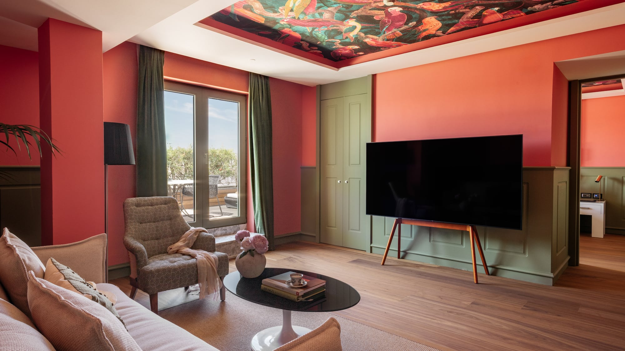 a living room with a tv and couches