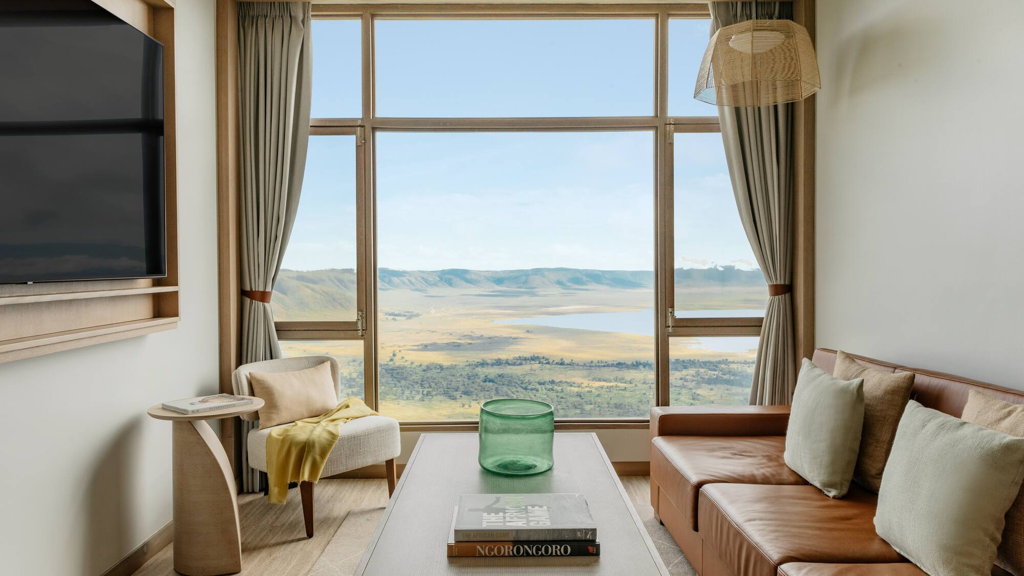 a living room with a view of a valley and mountains