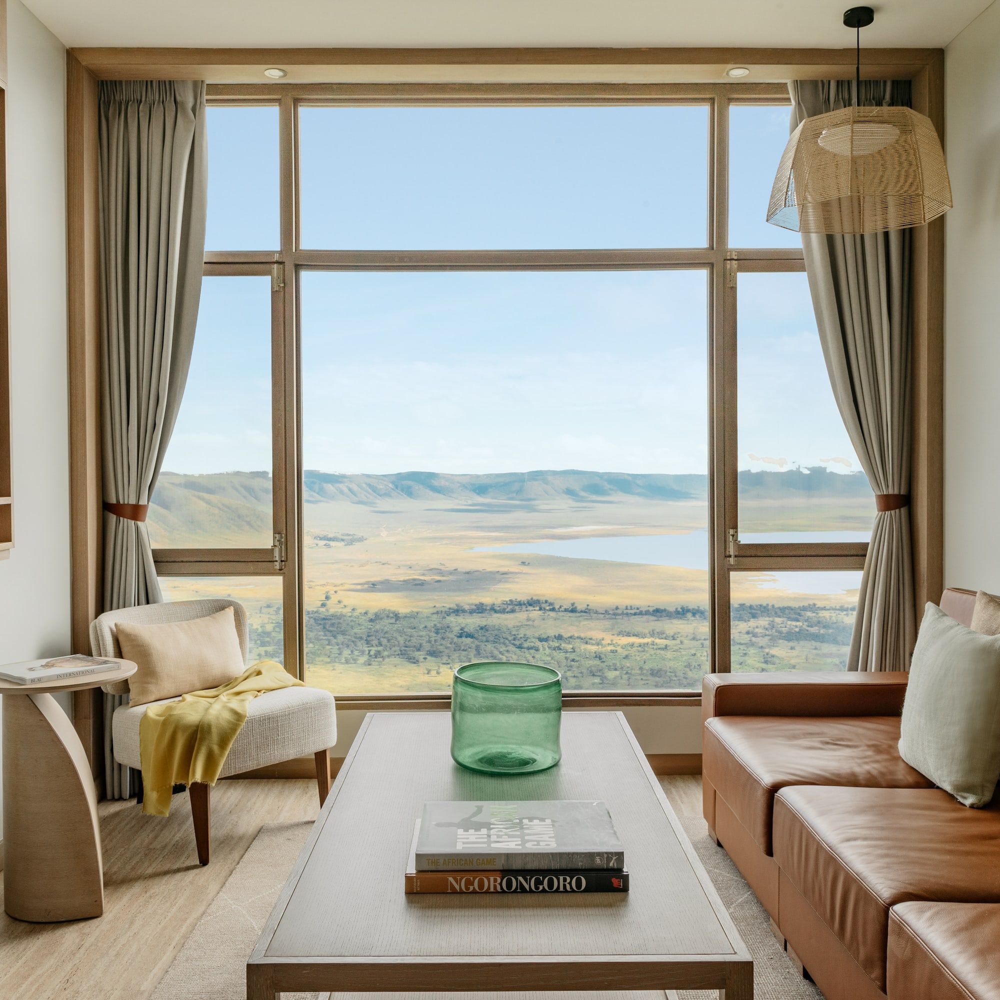 a living room with a view of a valley and mountains