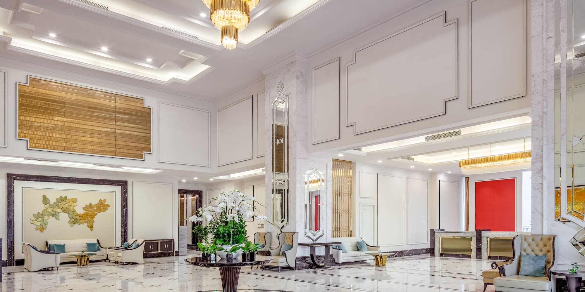 a large room with a large chandelier and a flower pot