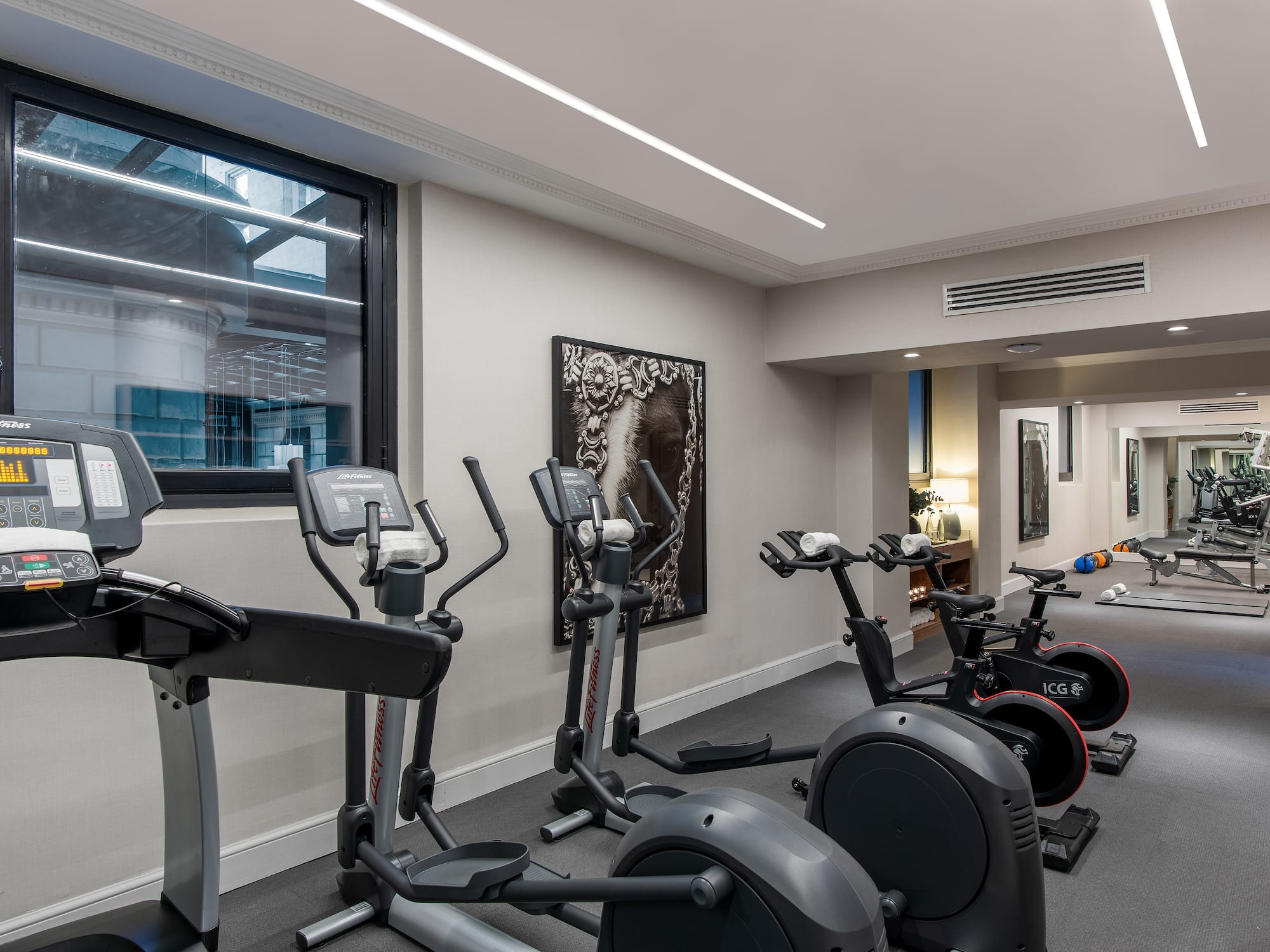 a room with exercise bikes and exercise equipment