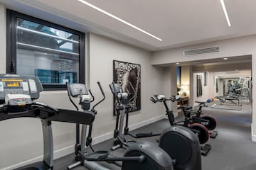 a room with exercise bikes and exercise equipment