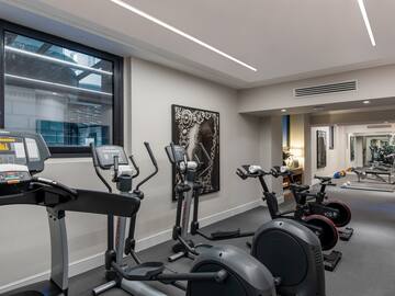 a room with exercise bikes and exercise equipment