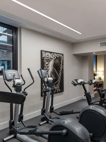 a room with exercise bikes and exercise equipment
