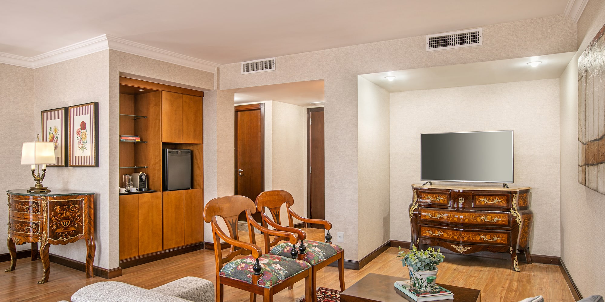 a living room with a television and a couch