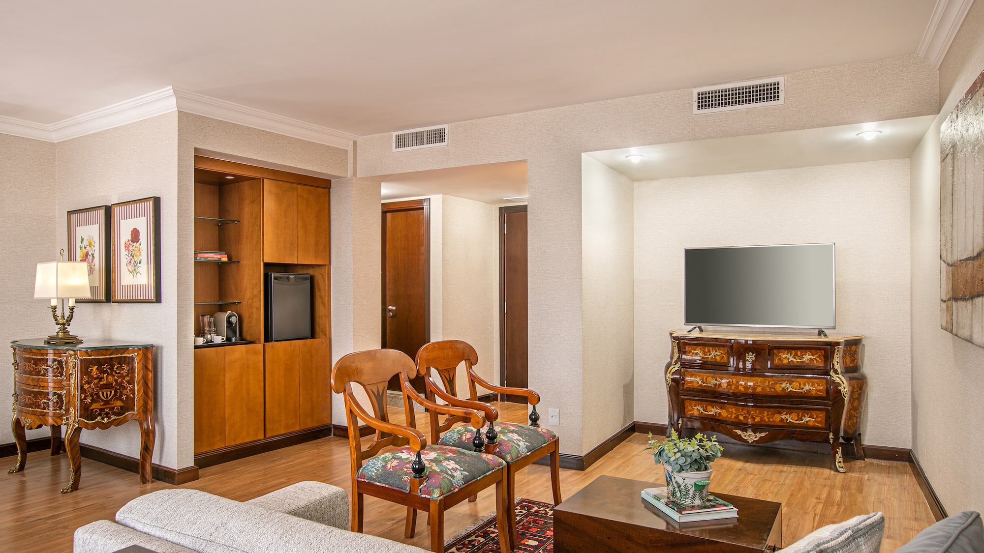 a living room with a television and a couch