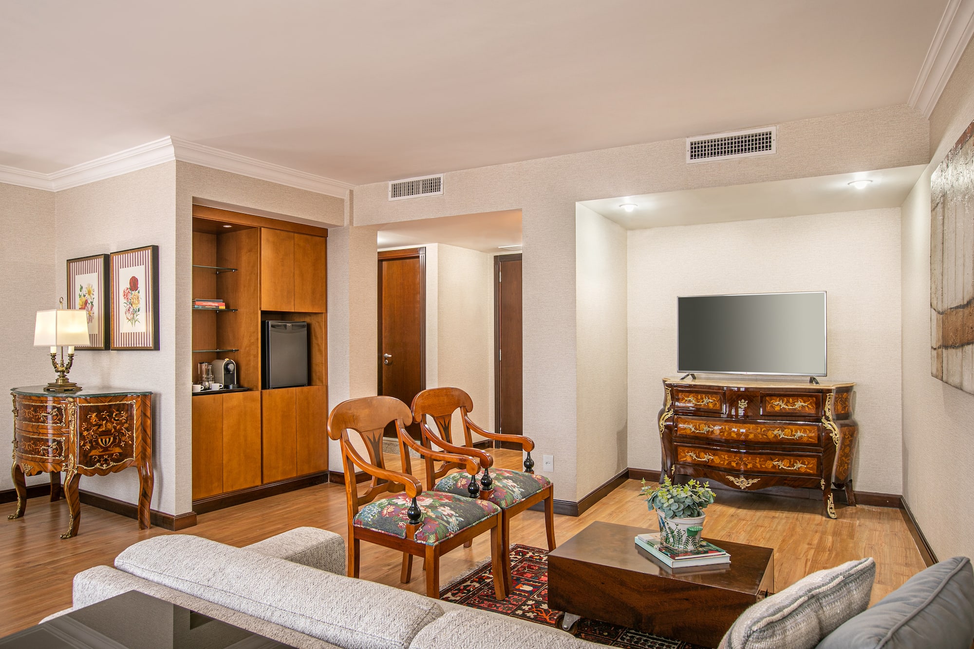 a living room with a television and a couch