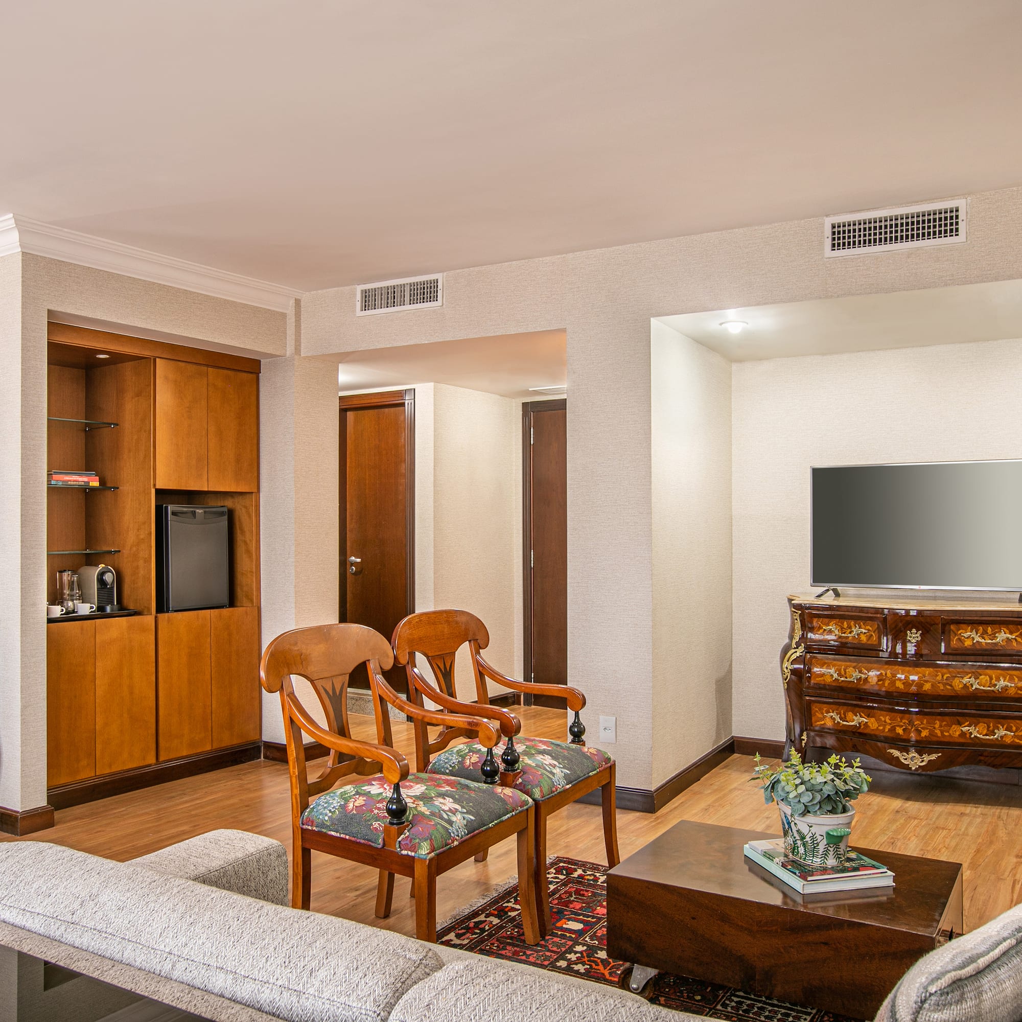 a living room with a television and a couch