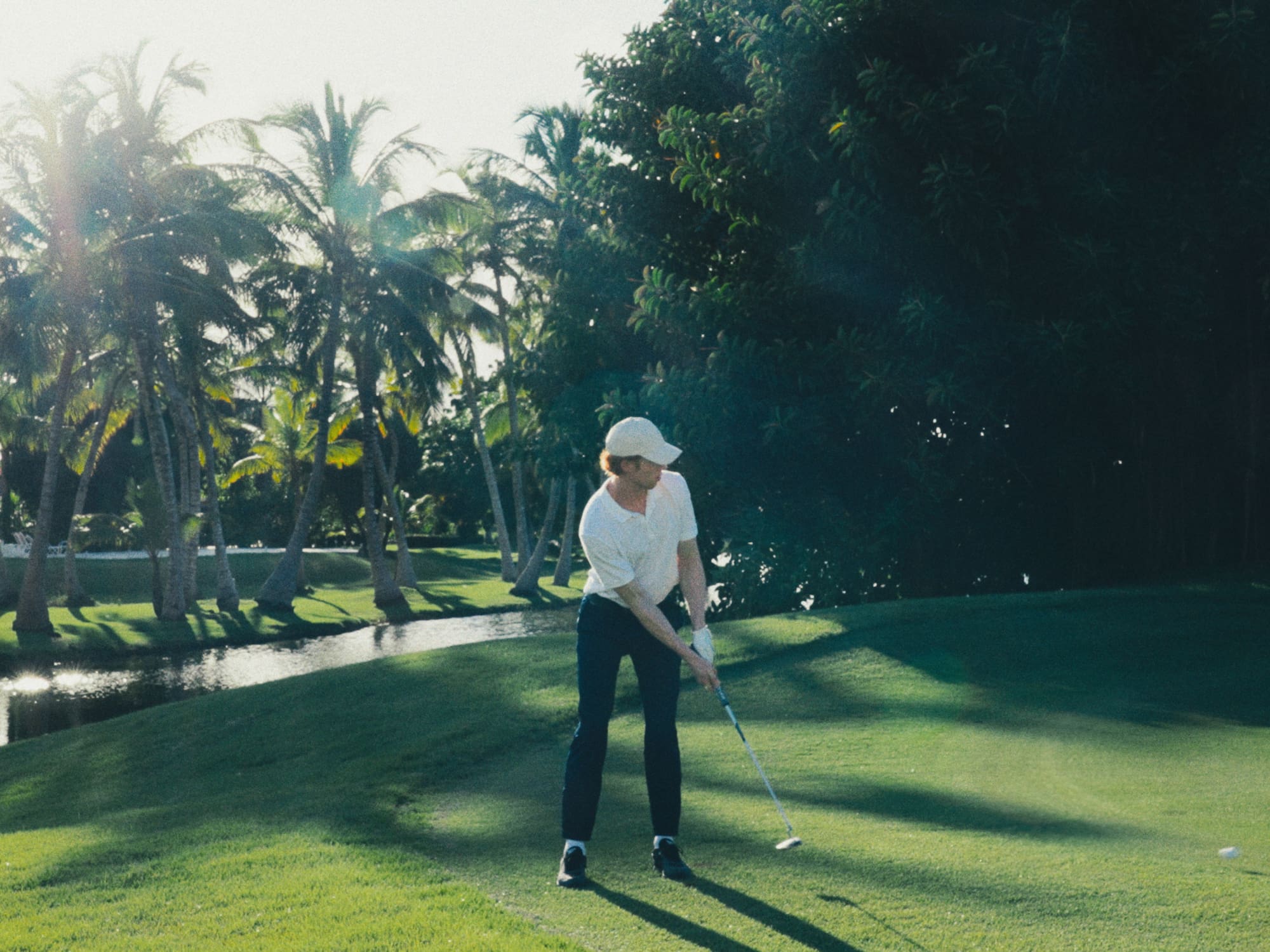 a man playing golf on a golf course