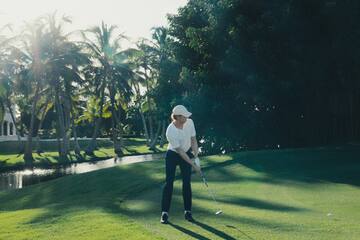 a man playing golf on a golf course