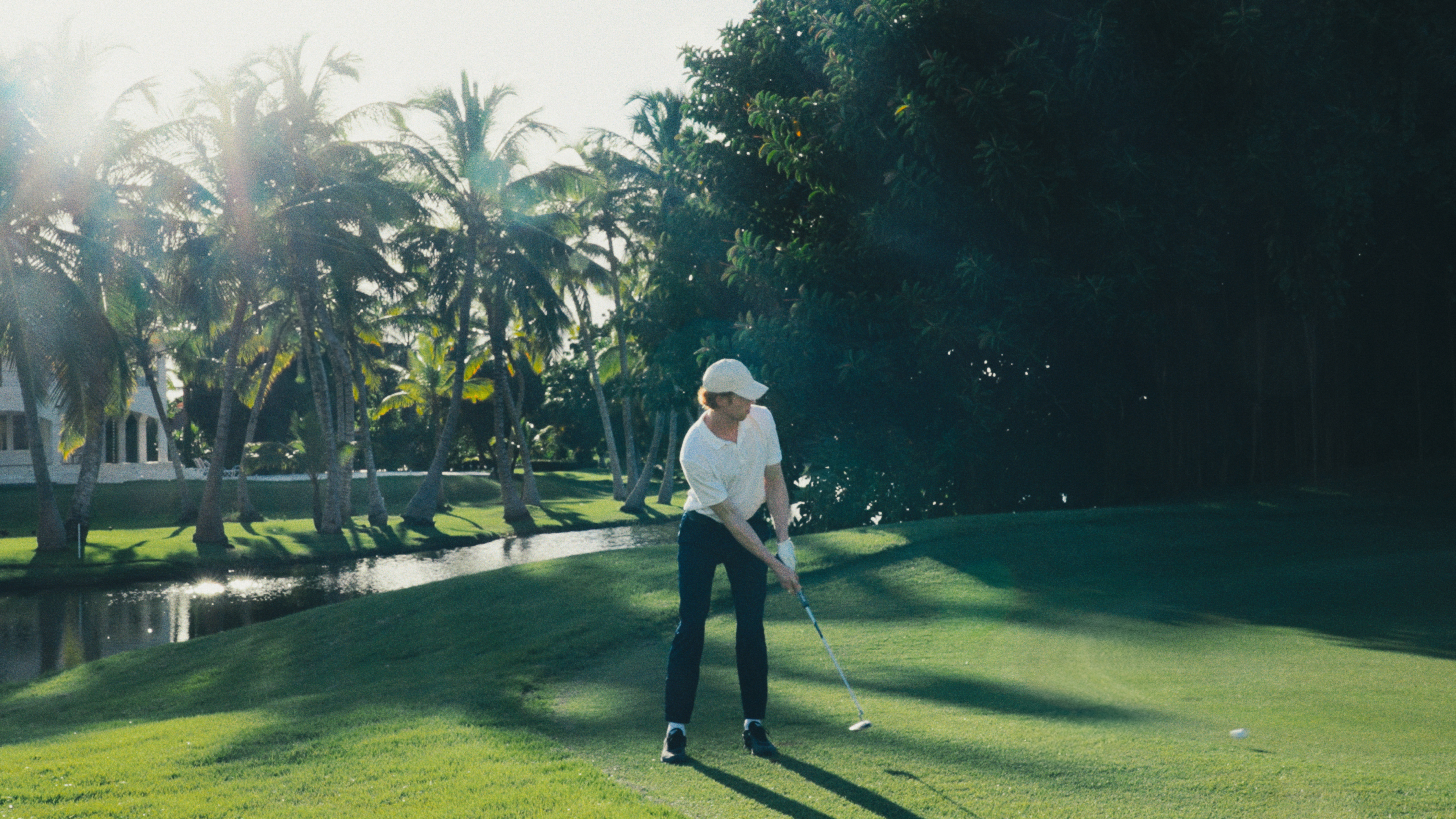 a man playing golf on a golf course