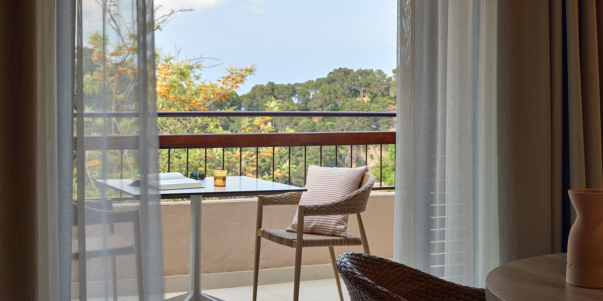 a table and chair on a balcony