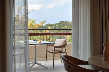 a table and chair on a balcony
