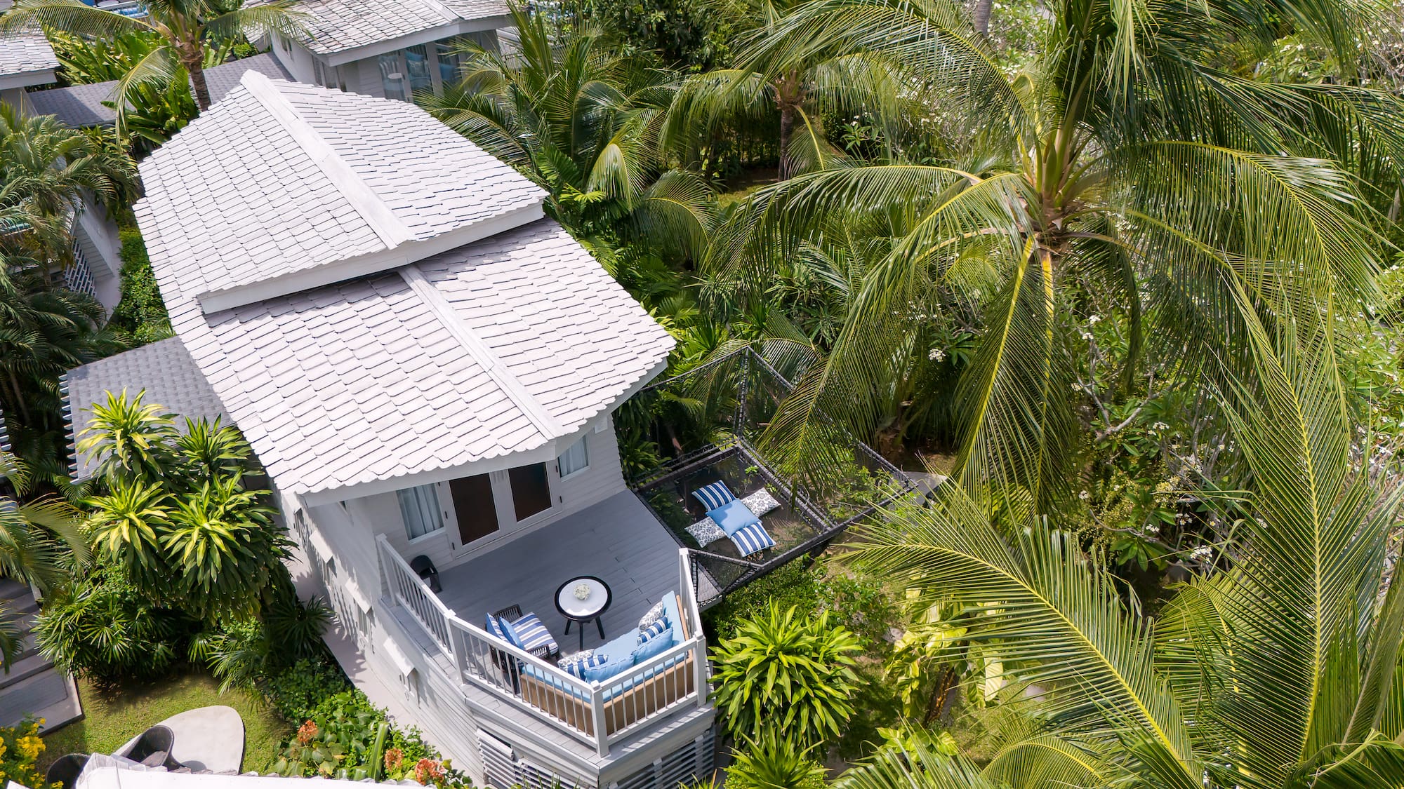 a house surrounded by palm trees