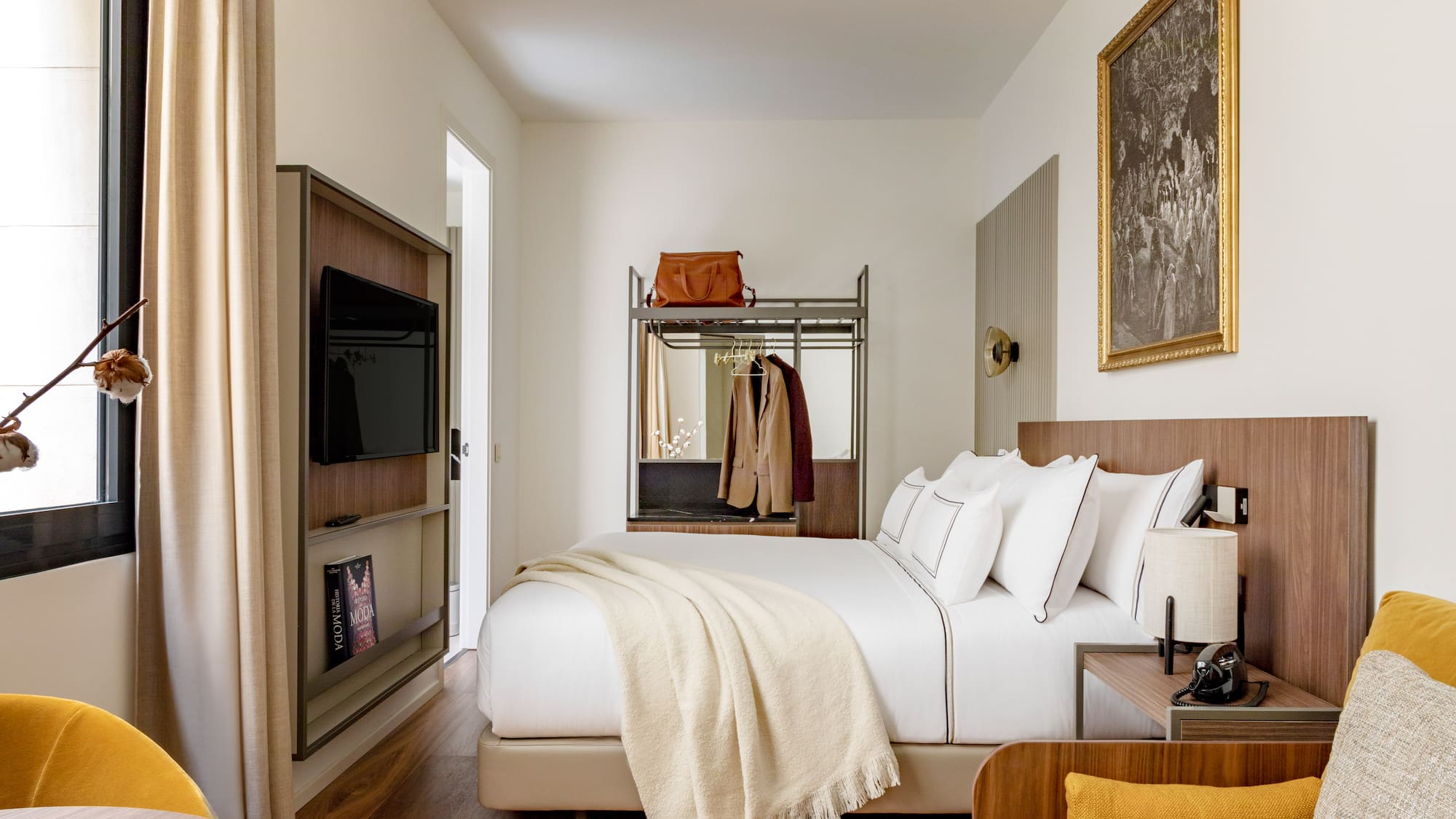 a bedroom with a bed and a tv