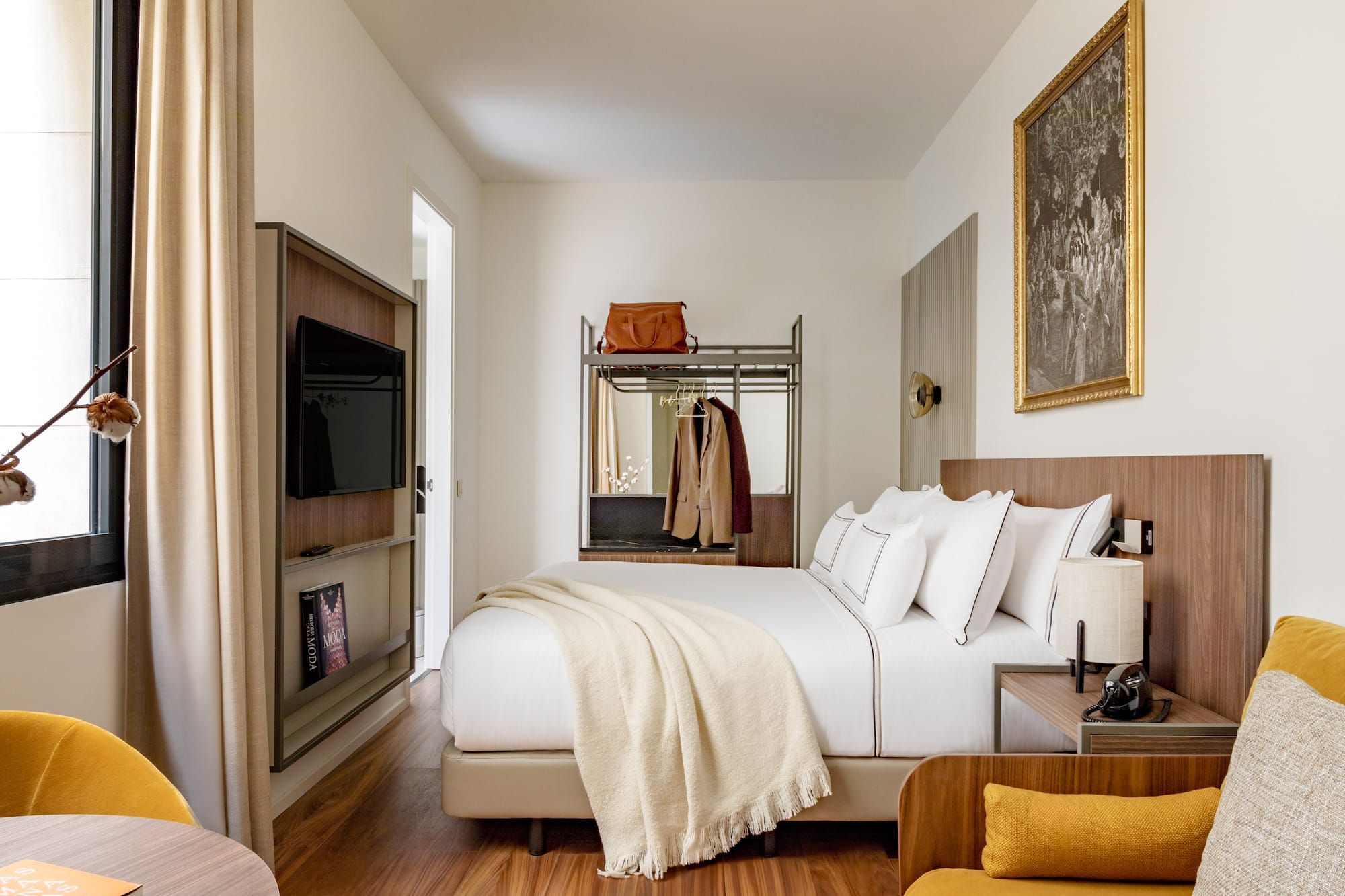 a bedroom with a bed and a tv