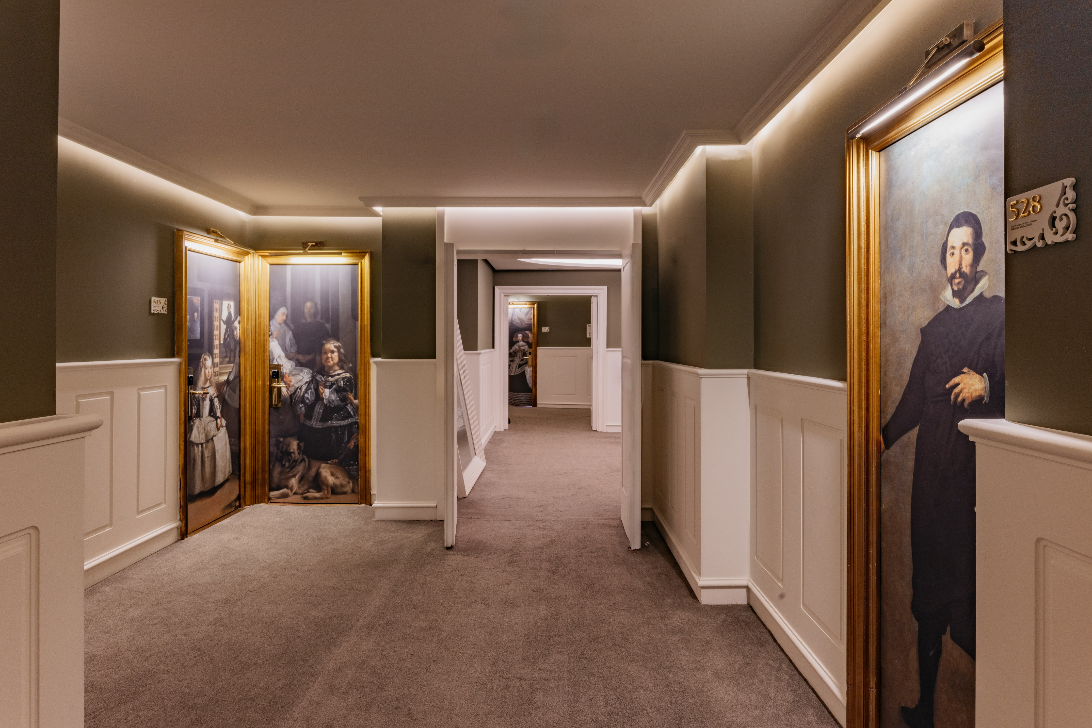 a hallway with art on the wall