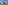 a white house with a lawn and trees
