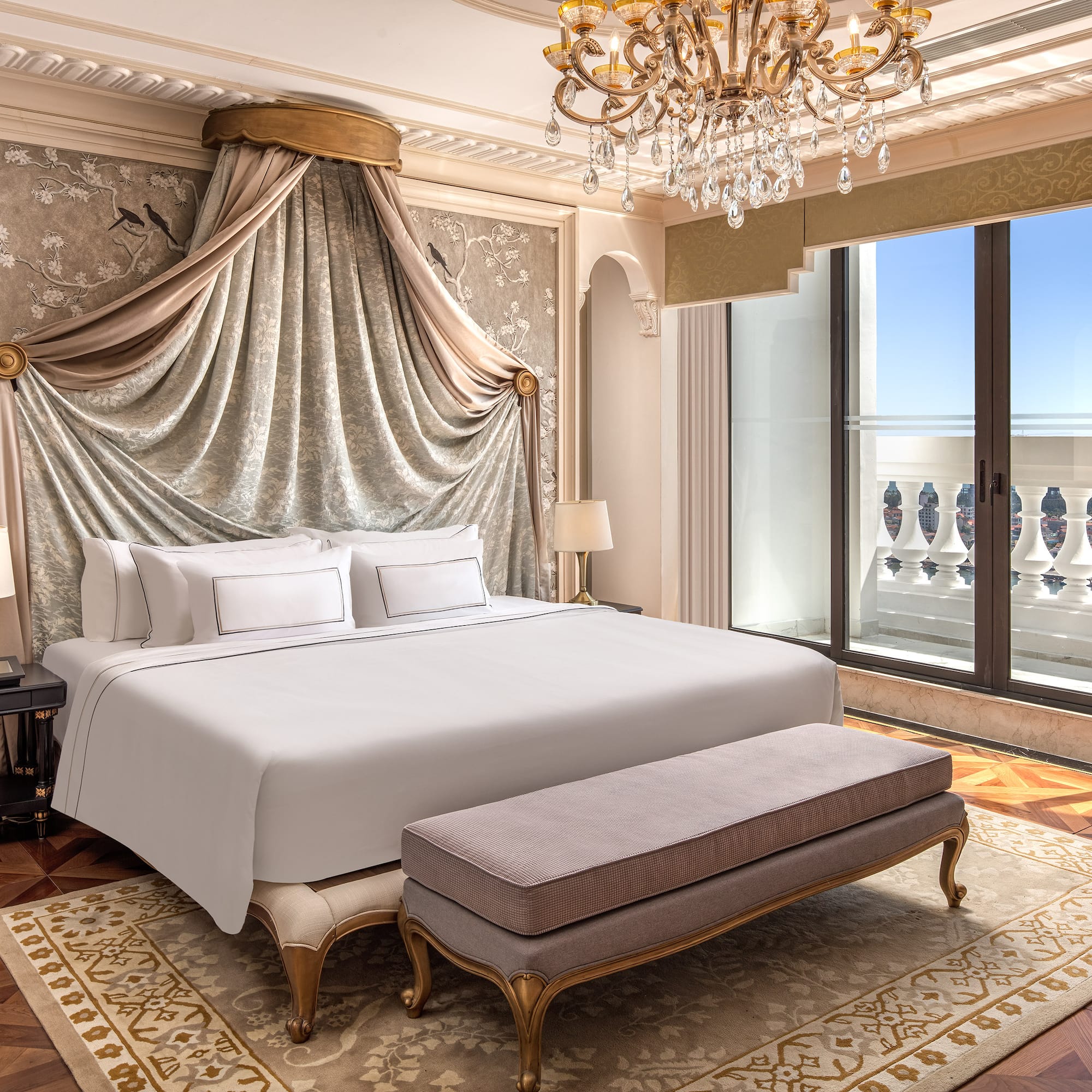 a bedroom with a bed and a chandelier