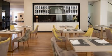 a room with tables and chairs