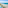 Beachfront resort with pools, palm trees, sandy beach, and blue ocean.