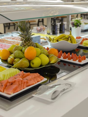 a buffet table with different fruits