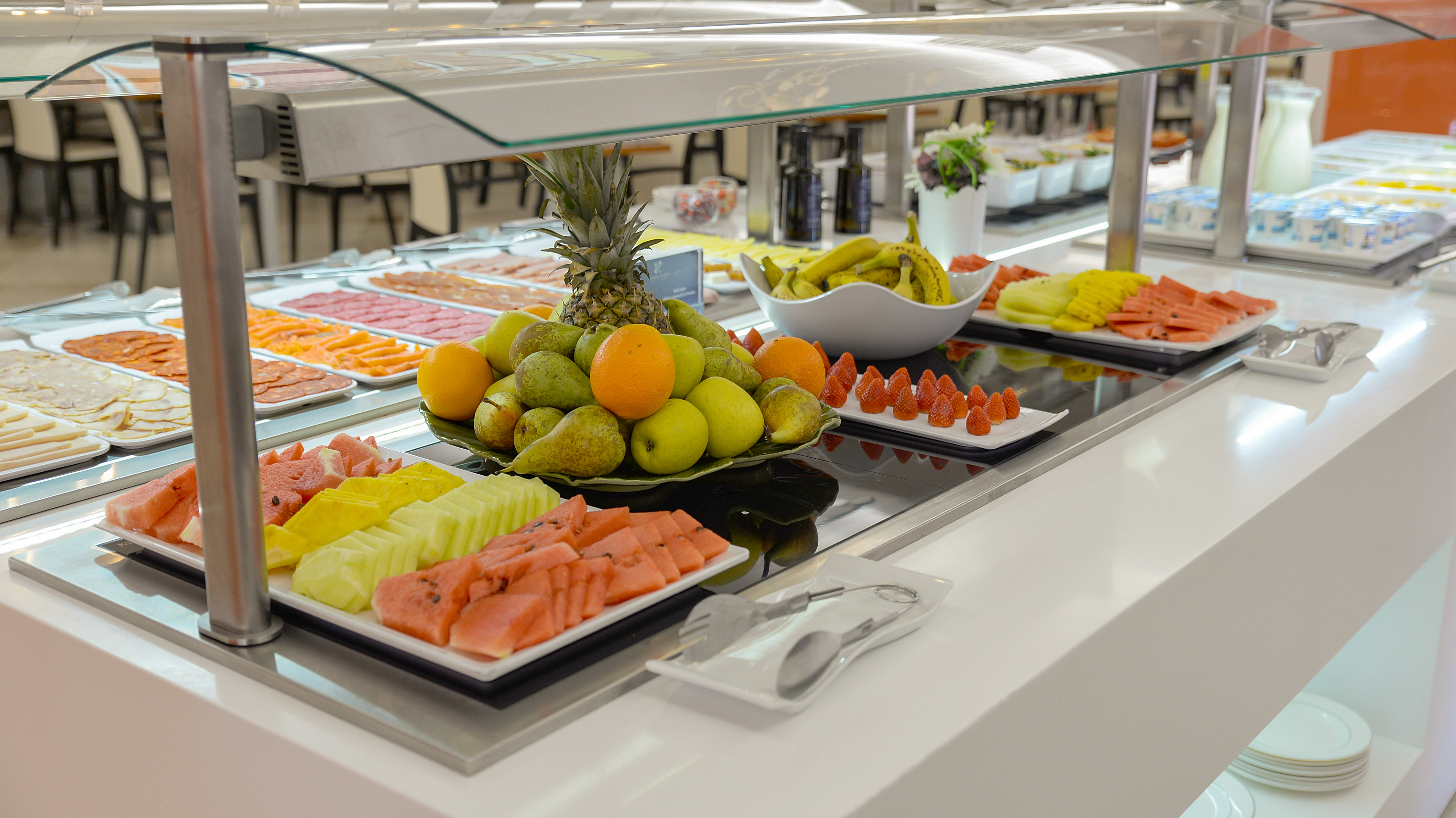 a buffet table with different fruits