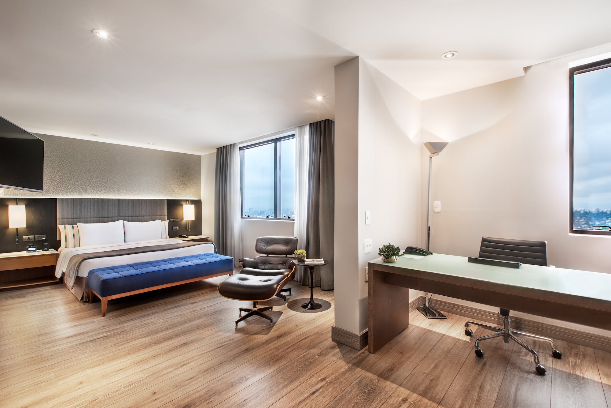 a room with a bed and a desk