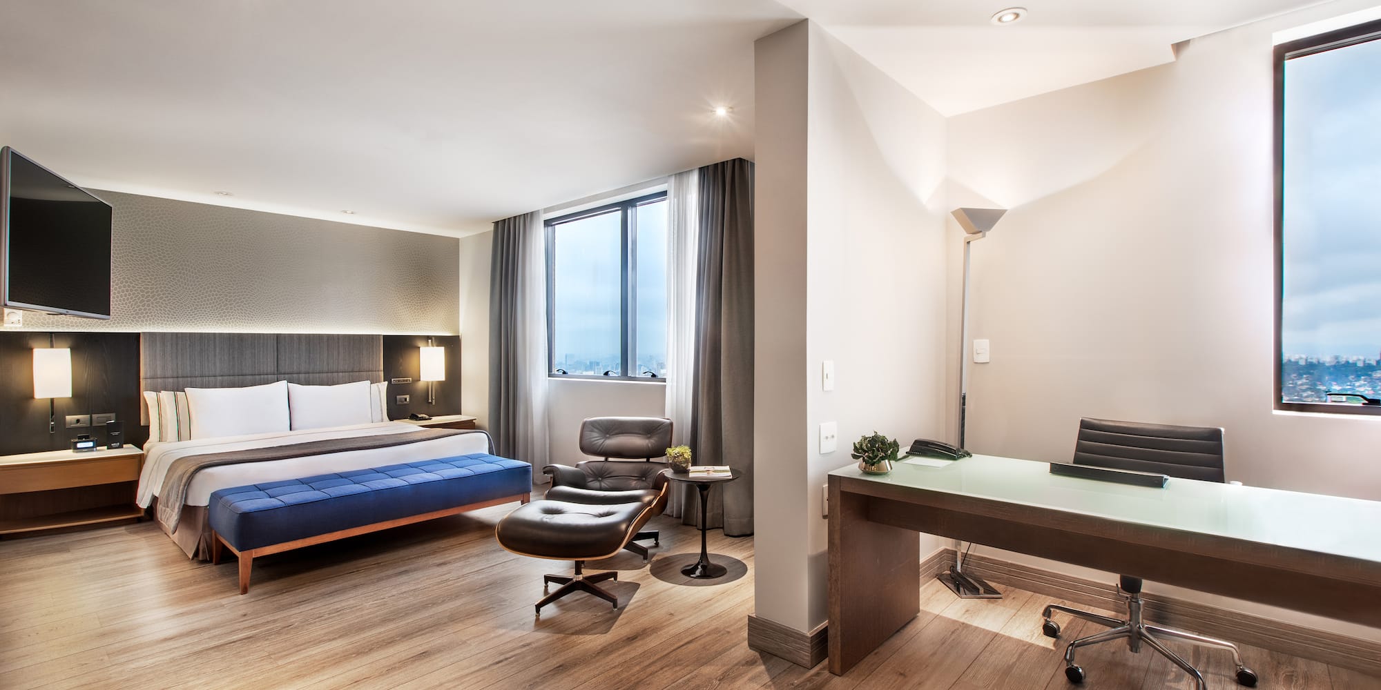 a room with a bed and a desk