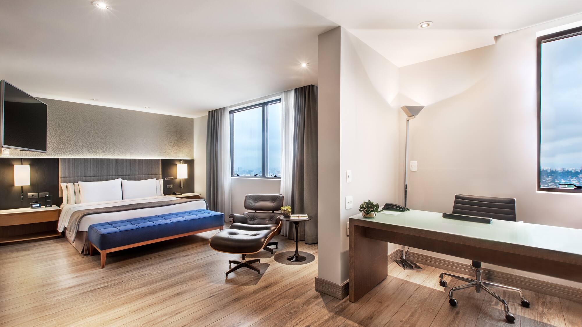 a room with a bed and a desk