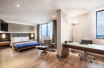 a room with a bed and a desk