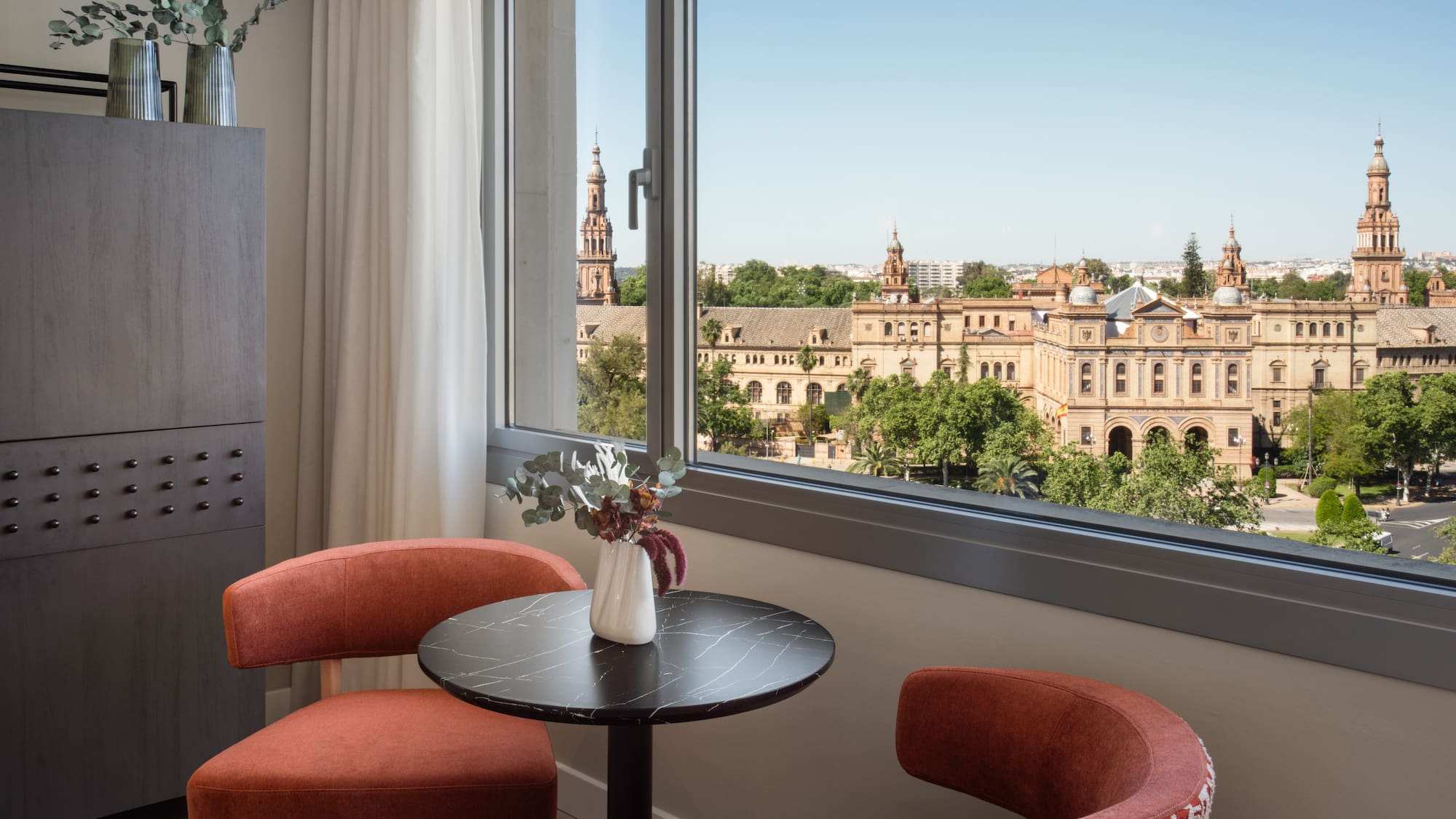 a table and chairs by a window
