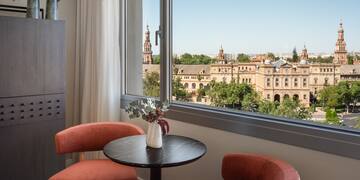 a table and chairs by a window