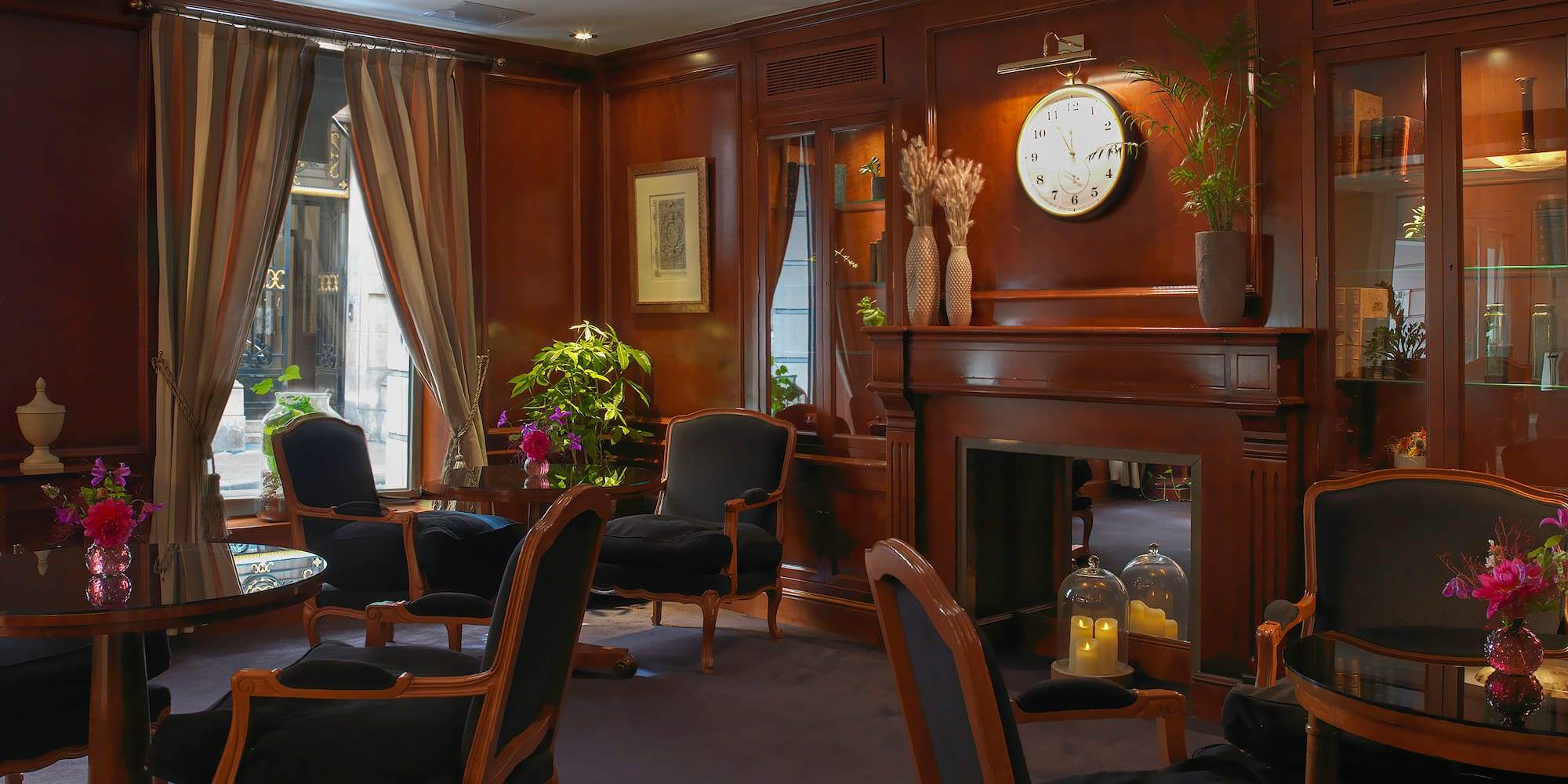 a room with a fireplace and chairs