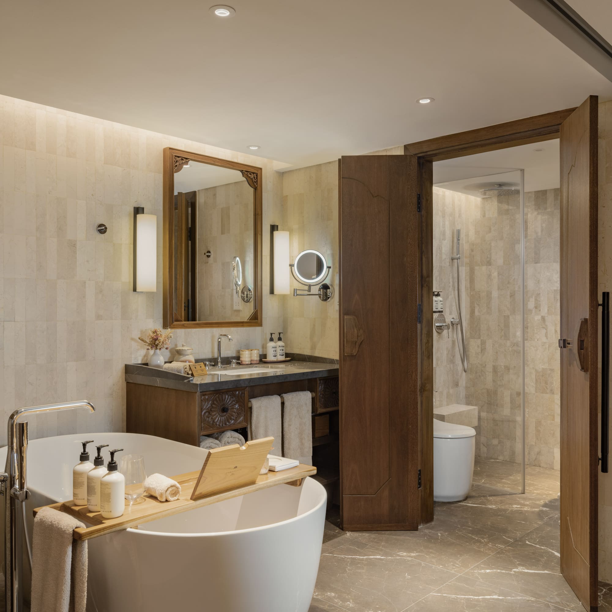 a bathroom with a tub and a shower