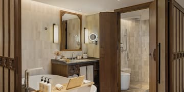 a bathroom with a tub and a shower