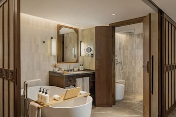 a bathroom with a tub and a shower