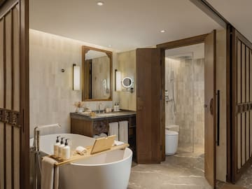 a bathroom with a tub and a shower