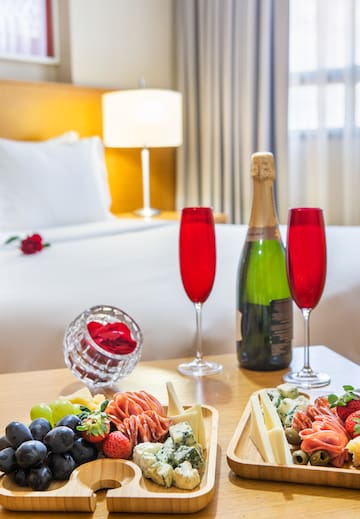 a table with food and wine glasses on it