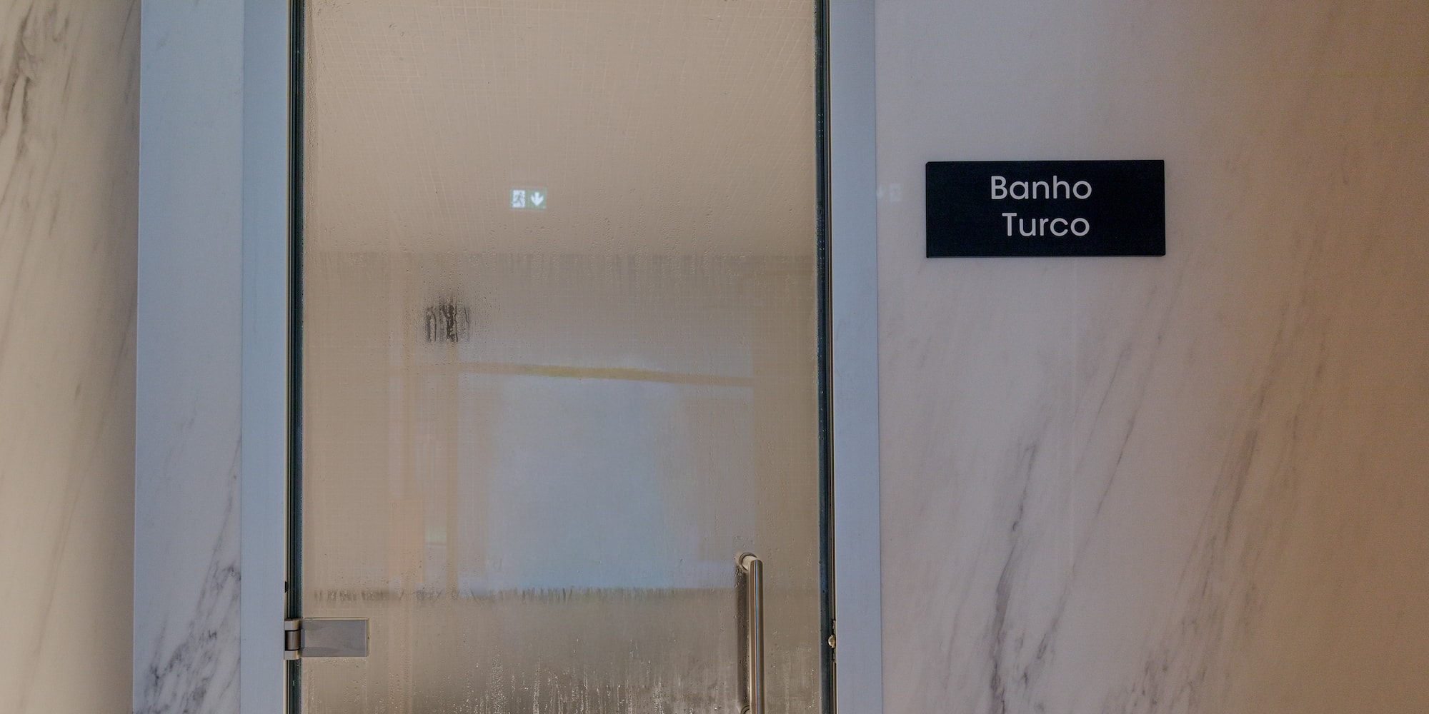 a glass door with a sign on it