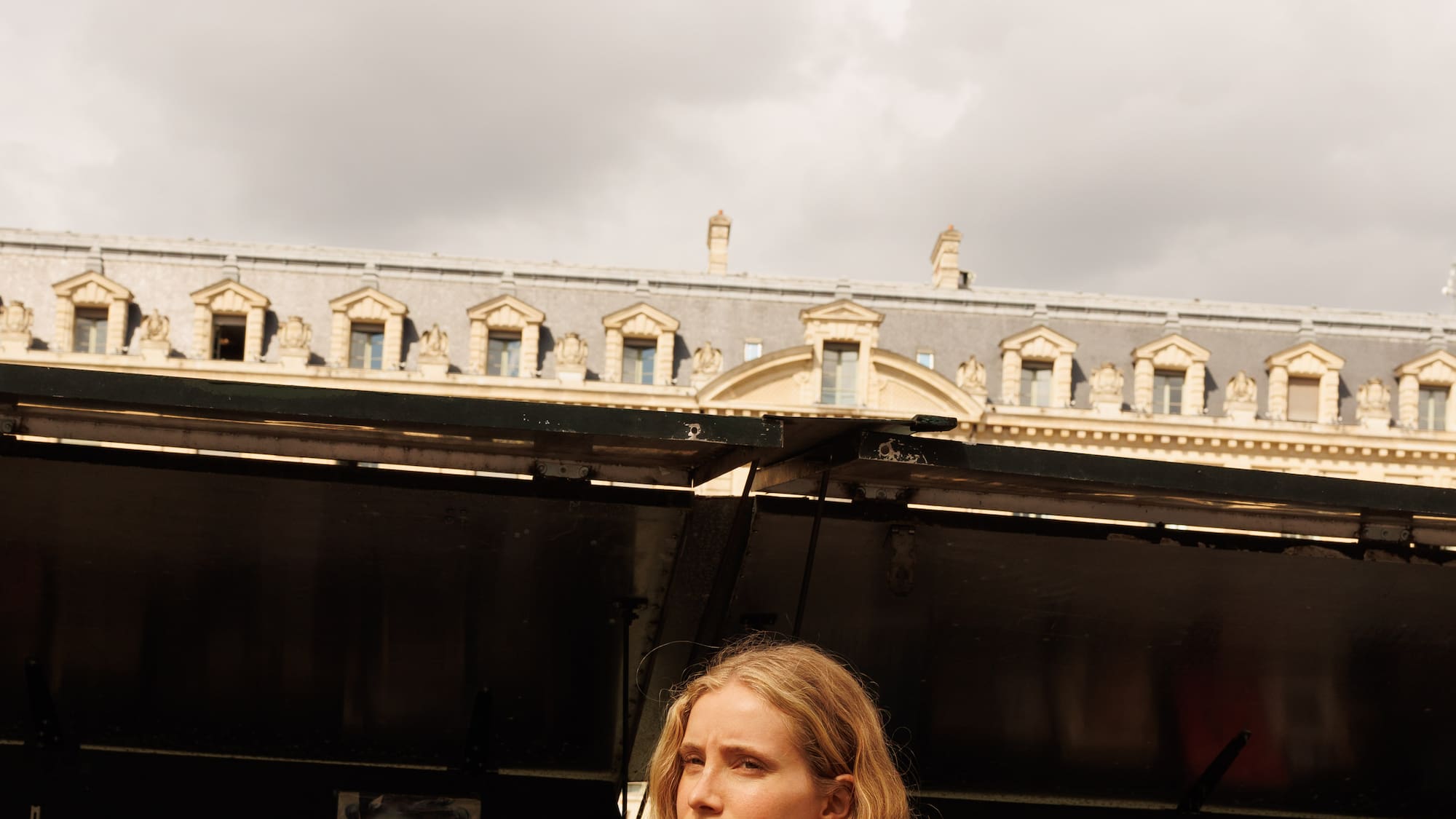 a woman holding a sandwich
