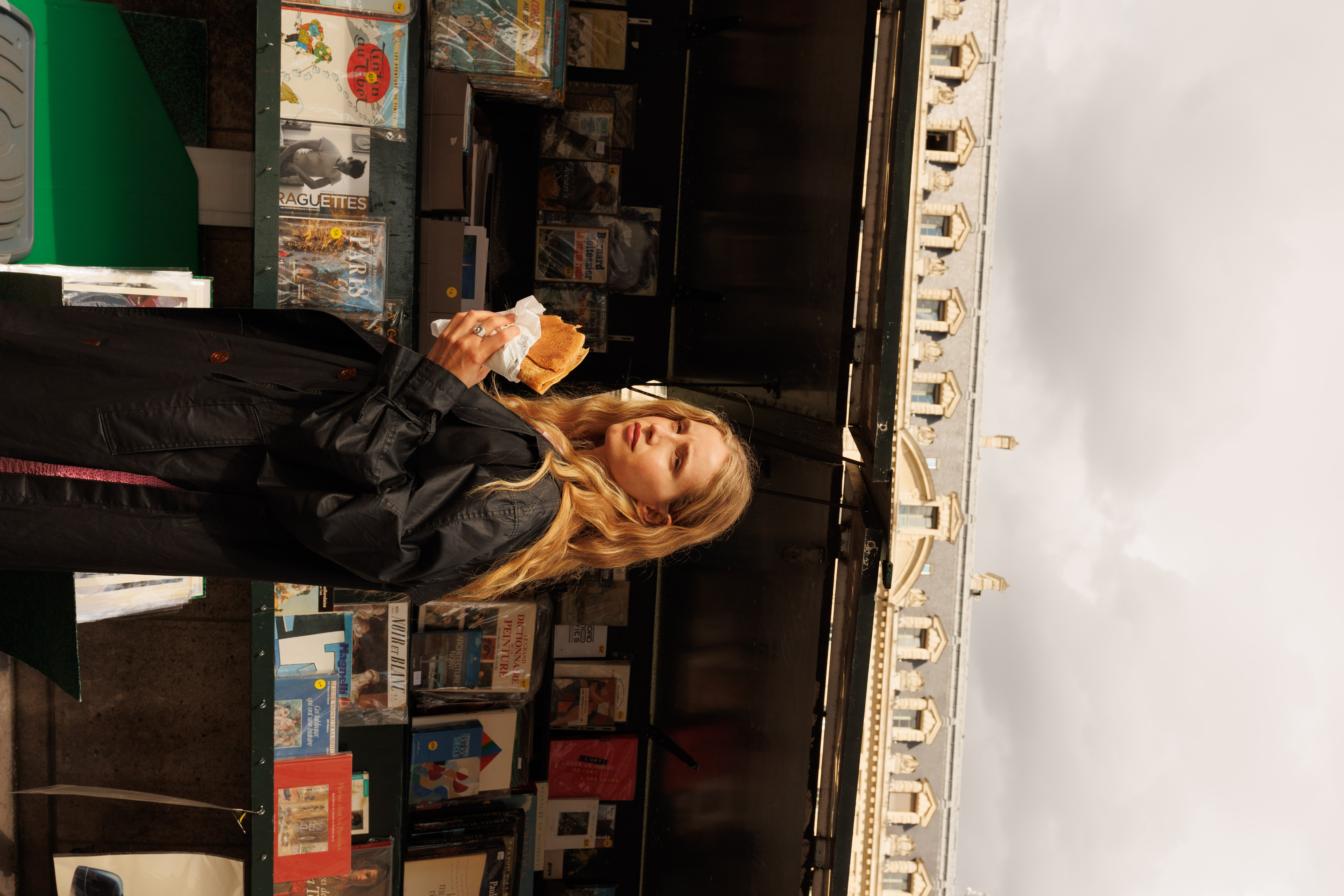 a woman holding a sandwich