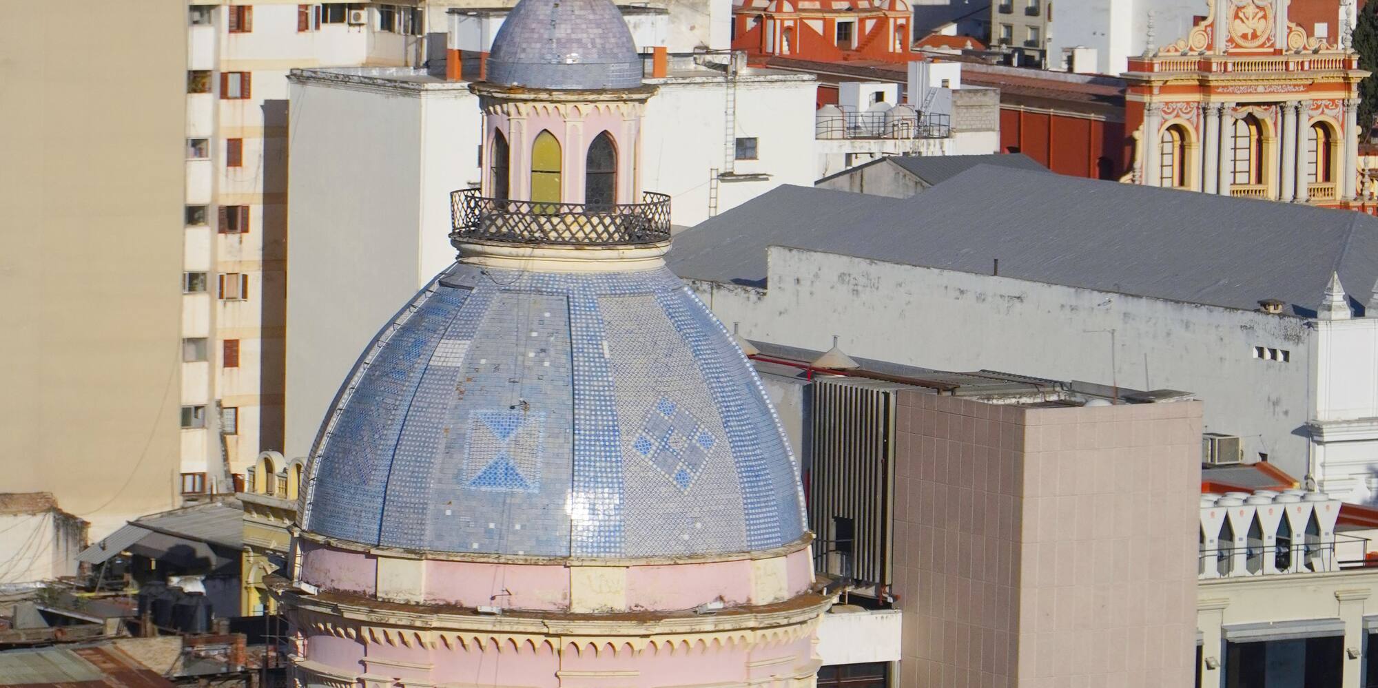 a building with a dome and a blue roof