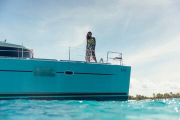 a woman standing on a boat