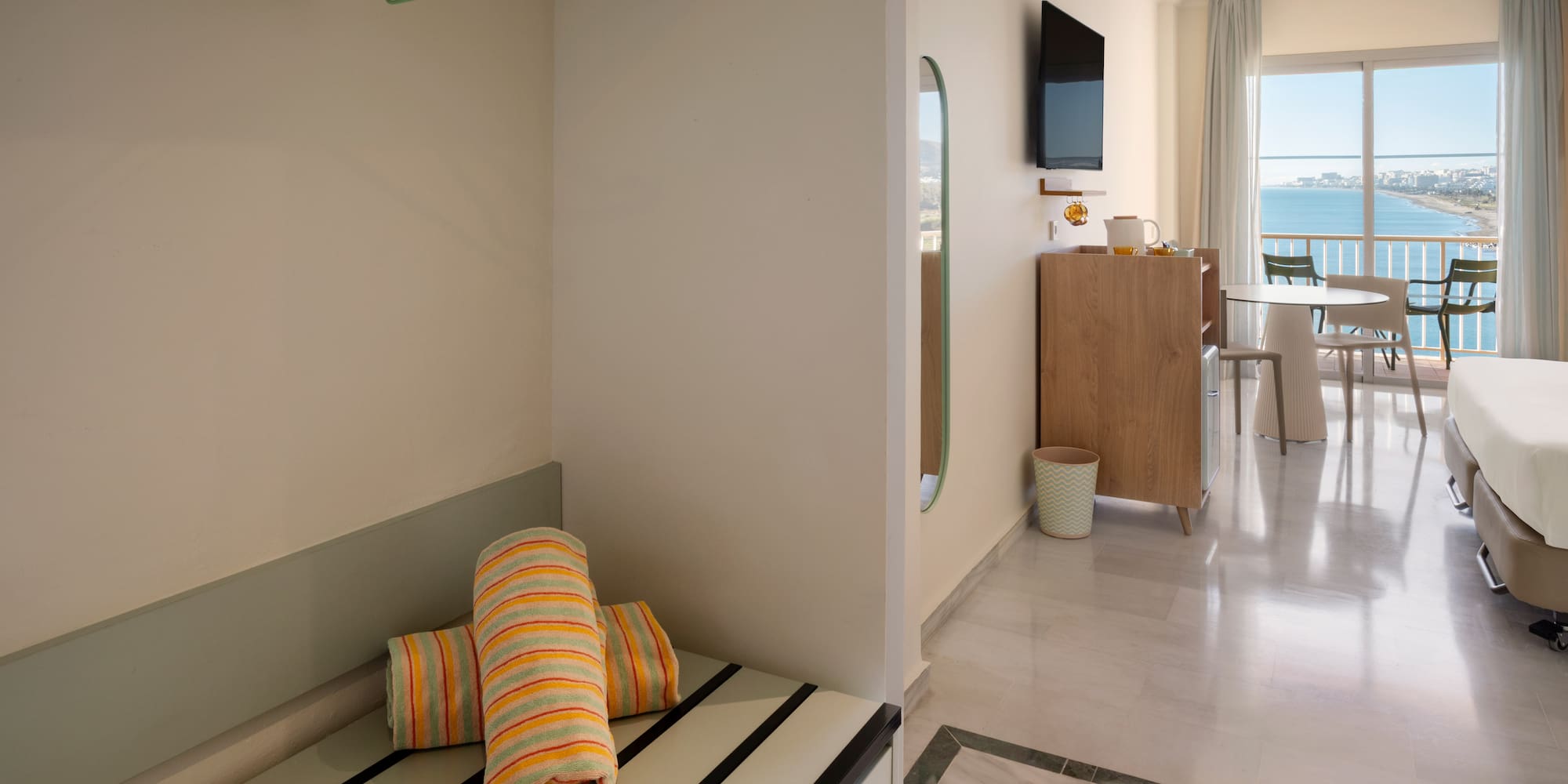 a room with a television and a bed